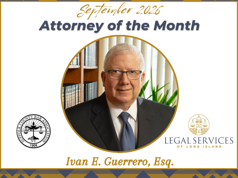 September 2026 Attorney of the Month graphic featuring Ivan E. Guerrero, Esq. His portrait is centered within a gold circle. The Suffolk County Bar Association logo appears on the left and the Legal Services of Long Island logo appears on the right.