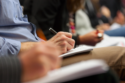 Close-up,Of,Hands,Holding,Pens,And,Making,Notes,At,The